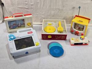 lot 291 image: Vintage Fisher-Price and Playskool Toys including TV toy, a music box record player with discs, a pocket camera, and a Playskool toy with bear and star decorations