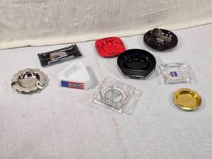 lot 301 image: Vintage Ashtrays from Citizens State Bank of Norwood, a 1976 Farmfest piece, and others from businesses like Kubes and Standard Oil
