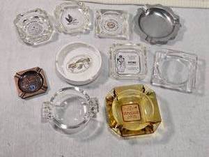 lot 302 image: Vintage Ashtrays like L.W. Barrett Co. and Home Furniture Co., while others have designs of Canadian geese and golf themes