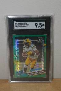 lot 41 image: 2023 Donruss Optic Dontayvion Wicks Green Hyper Prizm Rookie Football Card - SGC 9.5