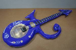 lot 226 image: Inflatable Replica of Princes Iconic Symbol Guitar - Game Giveaway