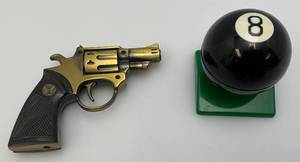 lot 13 image: Misc. Vintage Novelty Lighters Including Pistol & 8 Ball