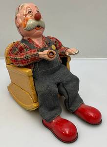 lot 32 image: 1950s-60s Battery Operated Tin Litho Grandpa In Rocking Chair With Pipe Made In Japan (Untested) 7 12 Tall