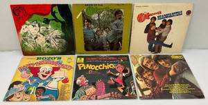 lot 64 image: Vintage Albums Including Grimm, The Monkees, Pinnocchio And BOZOS Happy Birthday Party