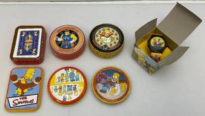 lot 109 image: Misc. SIMPSONS Collectibles Including LCD Watch, Playing Cards And Coaster Sets (Some NIB)