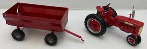 lot 111 image: Vintage McCormick Farmall Die-Cast Tractor With Plastic Wagon