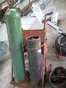 lot 20 image: Oxygen and Acetylene tanks on 3-whe...