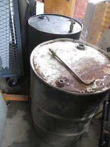 lot 65 image: Pair of 55-gallon oil drums (presum...