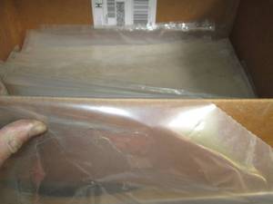 lot 225 image: Box of open ended 19x27in clear pla...