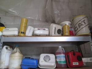 lot 229 image: Lot of Honda gas tanks, Cat oil fil...