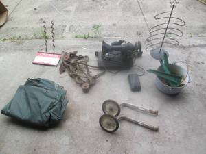 lot 107 image: Vintage Singer sewing machine, bike training wheels, and other treasures