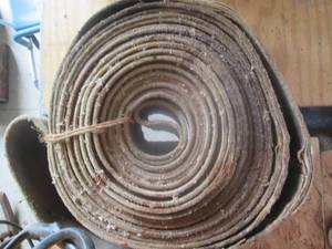 lot 150 image: Roll of vintage tractor belt