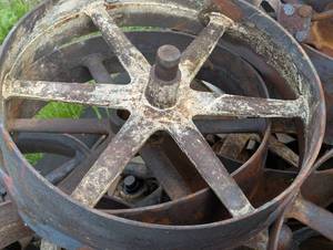 lot 92 image: Large Iron Wheel - Bidding on 1 with QTY of 8 - Pick Which Ones You Want - Very Heavy