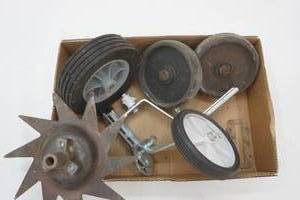 lot 263 image: Training Wheel Brackets, Wheels, and Aerator Mantis Blade