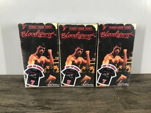 lot 219 image: 3 - Collectible Funko Home Video Bloodsport Movie T-Shirts in VHS box (T-shirts only no movie)