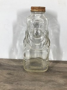 lot 420 image: vintage Grapette Family Beverage Syrup Clown Bottle, often used as a coin bank