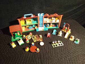 lot 197 image: Fisher Price house with lots of accessories including some wooden people