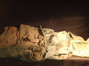 lot 143 image: 4 Canvas duffle bags and a rain poncho