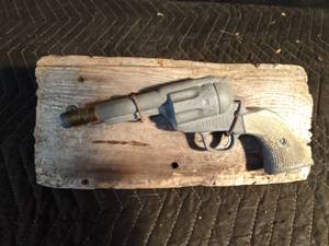 lot 128 image: Vintage 78 cap pistol mounted on wood