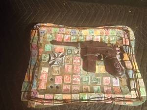 lot 130 image: Metal 1896 German Mauser pistol mounted on a tin tray of collectible German stamps with a metal cross