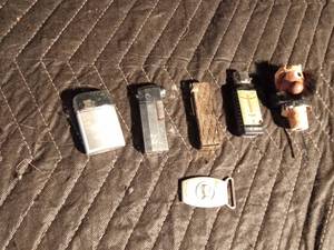 lot 119 image: 4 Lighters including Michelob and British Empire made Ronson, liquor bottle cork and a small belt buckle