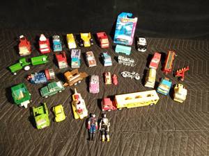 lot 106 image: Mostly metal collectible vehicles including Yellow Submarine, Snoopy car, Woodstock car and Hot Wheel in package and more