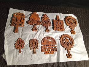 lot 103 image: 9 Cast iron trivets