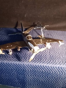 lot 84 image: Cast aluminum metal aviation propeller airplane and 1970 American aluminum table model of a jet