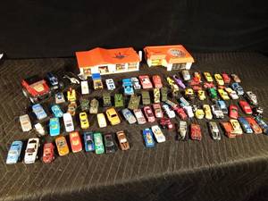 lot 82 image: 1968 Hot Wheels super charging station and 1969 Hot Wheels speedometer and approximately 85 die cast and plastic vehicles (some made in Great Britain) and more
