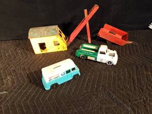 lot 75 image: Vintage metal Buddy TeePee camper trailer, part of a metal crane, plastic Marigold Dairy Products truck, Bank & Cities service truck