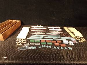 lot 40 image: Wood box of metal ship yard including 8 long ships, 12 little ships, buildingd, docks, and more
