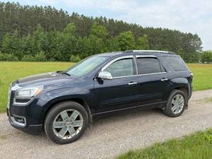 lot 3 image: GMC Acadia Denali AWD SUV in Black