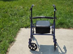 lot 65 image: Drive Medical Four-Wheel Rollator Walker with Seat and Storage Pouch