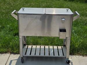 lot 71 image: Backyard Creations Stainless Steel Rolling Cooler with Storage
