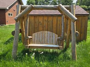 lot 79 image: Rustic Wooden Outdoor Swing with Log Construction