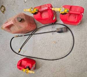 lot 90 image: Lot of Red Gas Cans with Spouts and Manual Transfer Pump