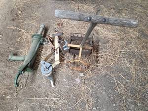 lot 107 image: Antique Farm Tools Collection - Seeder, Pump, and Winch
