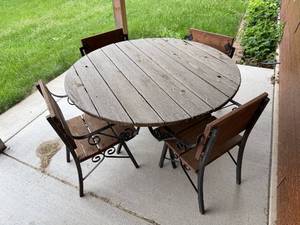 lot 122 image: Outdoor Patio Set with Rustic Wooden Table and Iron Frame Chairs
