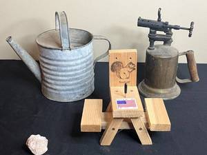 lot 187 image: Vintage Collection Watering Can, Woodlink Squirrel Feeder, Brass Blowtorch, and Ceramic Jar