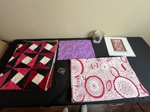 lot 206 image: Collection of Quilting Fabrics, Calendar, Vintage Sewing Machine FigurineOrnament, and Jar of Sewing Notions