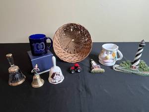 lot 207 image: Eclectic Collection of Novelty Items and Souvenirs Inc Lighthouse Figurine, Bells & Miniature Tractor