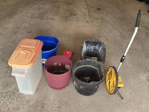 lot 262 image: Assorted Household and Garage Items Including Measuring Wheel, Containers, and Buckets