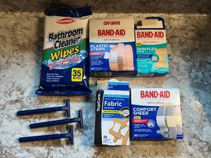 lot 367 image: Assortment of Band-Aids, Fabric Bandages, Bathroom Cleaner Wipes & Razors - content quantities unverified
