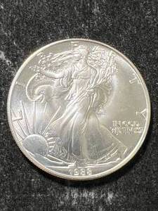 lot 12 image: 1988 AMERICAN SILVER EAGLE 1 TROY OZ .999 FINE SILVER