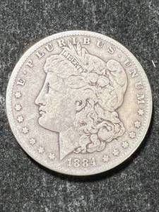 lot 31 image: 1884-S US MORGAN SILVER DOLLAR