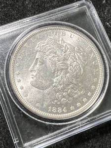 lot 57 image: 1884 US MORGAN SILVER DOLLAR IN CASE