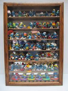 lot 93 image: Display Cabinet FULL of Vintage 1980s SMURFS Figures