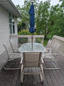 lot 29 image: Glass Topped Patio Table and Chairs