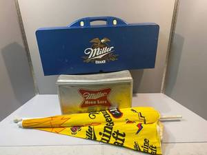 lot 68 image: Vintage Miller High Life Metal CoolerPicnic Table and Umbrella