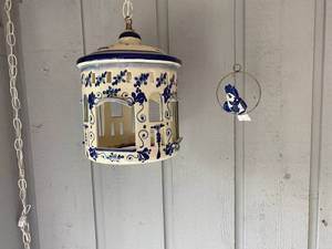 lot 104 image: Hanging Blue and White Pottery Bird Cage and Bird on a Swing